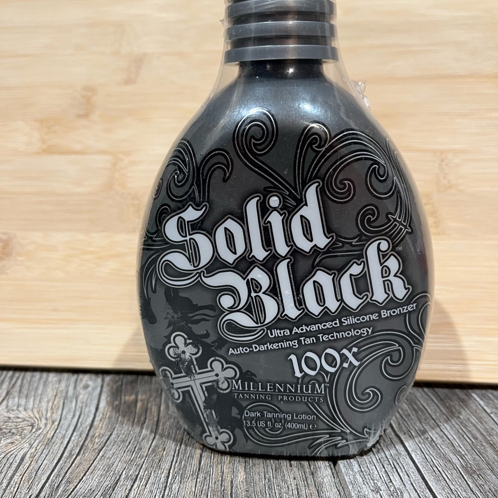 Millennium Solid Black tan bronzer. New sealed bottle.